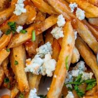 Buffalo Fries · Hand-cut fries tossed with buffalo sauce, topped with blue cheese crumbles & served with sid...