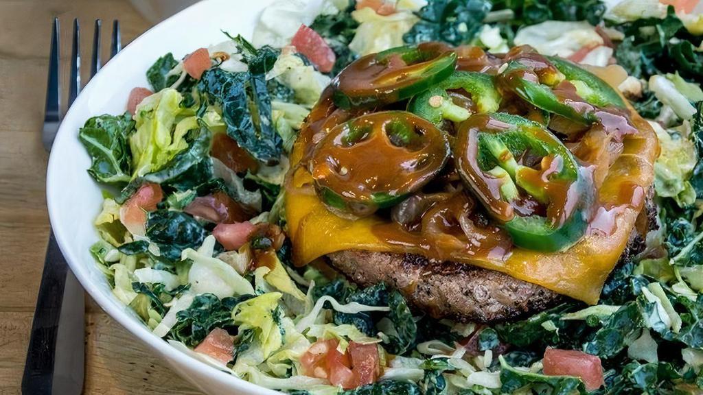 Goodnight As A Bowl · Our house greens tossed with cheddar cheese, caramelized onions, tomato, jalapeños, caffeinated BBQ sauce, Doddy Mayo and topped with our classic beef patty.  . A portion of the proceeds are donated to local charities doing amazing things in our neighborhood.. This item is gluten friendly.  If you have an allergy, please let the kitchen know.