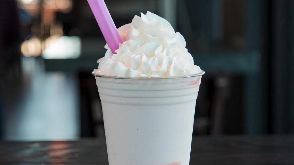 Strawberry · Vanilla custard blended with strawberry sauce, topped with whipped cream. This item is gluten friendly.  If you have an allergy, please let the kitchen know.