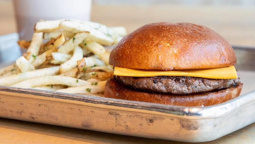 Kid'S Cheeseburger Meal · 1/4 lb beef patty on house-baked bun, served with a side of ketchup.  Includes hand-cut fries & your choice of kid's drink.
