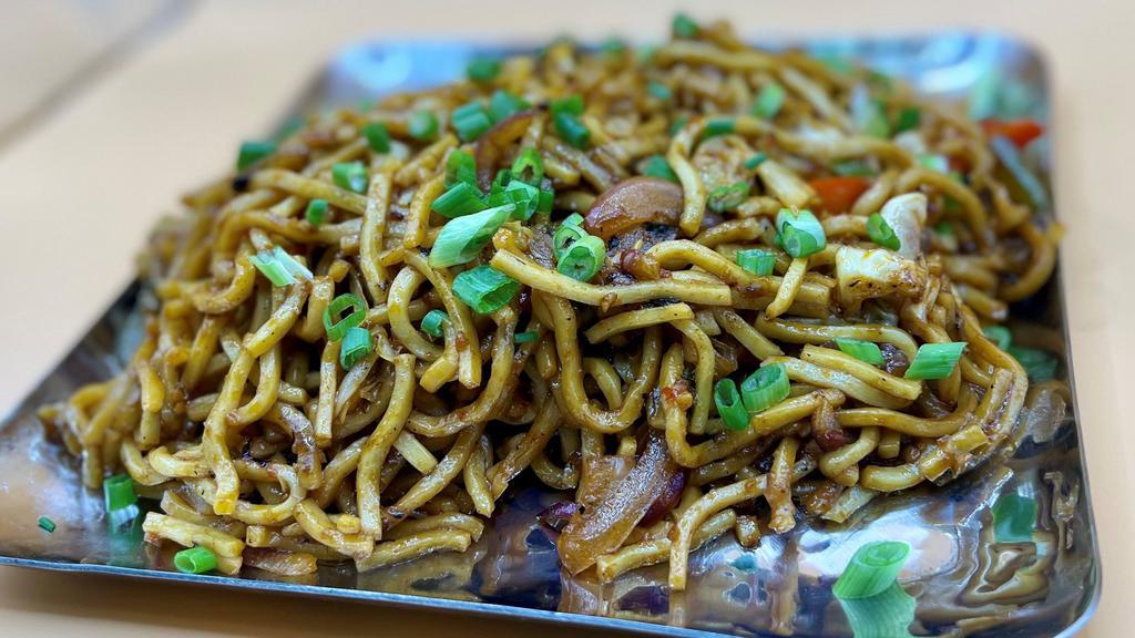 Vegetable Noodles · Vegetarian. Stir-fried noodles mixed with bell peppers and onions, seasoned with chili sauce and spices.
