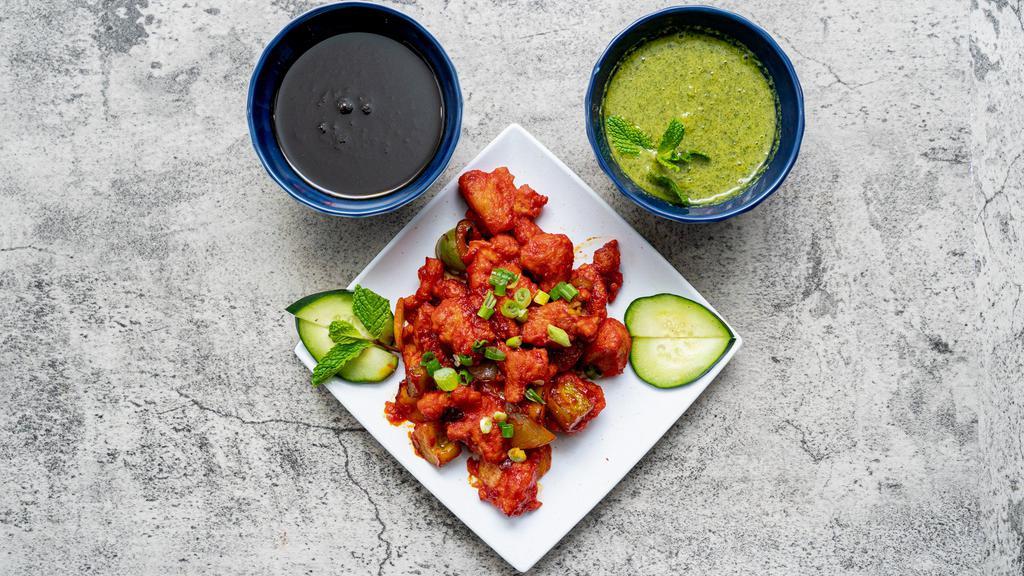 Chili Paneer · Spicy, vegetarian. Fried crispy cottage cheese chunks tossed in sweet chili sauce, sautéed with onions and bell peppers.