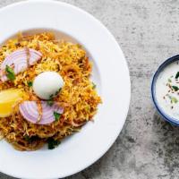 Chicken Biryani · Cooked with marinated and curried chicken pieces.