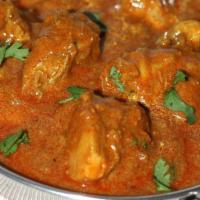 Chicken Curry · Boneless chicken thigh meat slow-cooked in a spicy curry.
