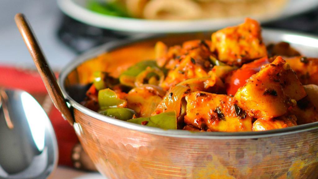 Kadhai Paneer · Vegetarian. Chopped bell peppers, tomatoes and onions tossed with Indian cottage cheese or paneer.