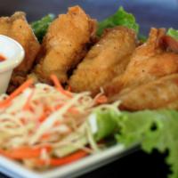 The Wing · Fried chicken wings. Choice of plain, orange sauce, or teriyaki sauce.