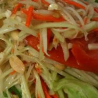 Papaya Salad · Spicy.Green papaya mixed with spicy lime dressing. Topped with peanut.