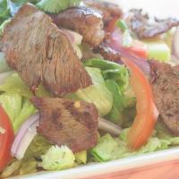 Beef Salad · Spicy.Spicy sour house dressing with grilled beef, cucumber, tomato, onions, on a bed of let...