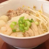 Teo Chew Noodle Soup · Flat noodle with shrimp, fish ball, chicken, ground pork, bean sprouts, topped with green on...