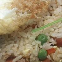 The Bowl Fried Rice · Fried rice with egg, peas, carrots, and meat loafs. Topped with fried egg.