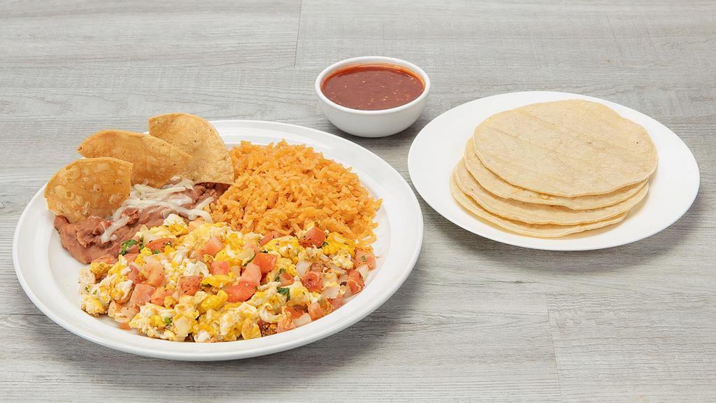 Huevos Al Gusto  · 2 eggs with choice of Ham, Mexican Sausage, A La Mexicana, Rancheros or just scrambled. Served with rice, refried beans, red or green salsa and corn tortillas.