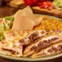 Stuffed Quesadilla Plate · A large flour tortilla filled with cheese and choice of meat. Served with rice and refried b...