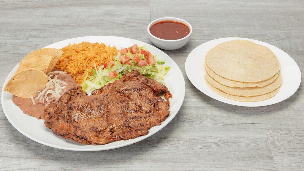 Carne Asada Plate · Beef Flap Steak served with rice, refried beans and corn tortillas.