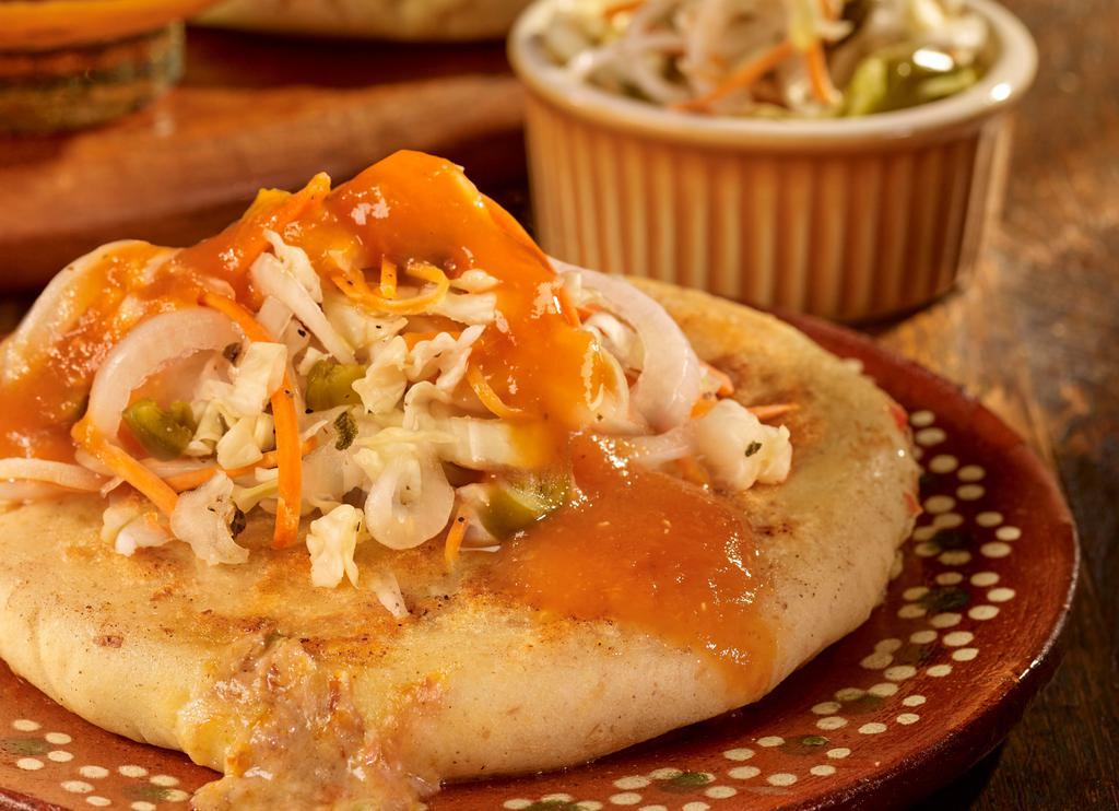 Pupusas · Served with pupusa salsa and pickled cabbage.