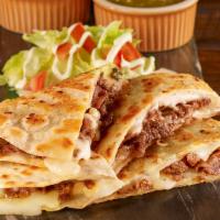 Stuffed Quesadilla · A large flour tortilla stuffed with cheese and choice of meat. Served with lettuce, tomatoes...