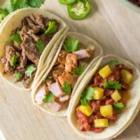 Street Taco · Served with a choice of green or red salsa, cilantro, onions, and lime.