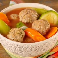 Albondigas De Res · Beef Meatball Soup served with rice, tortillas, cilantro, onions & lime.