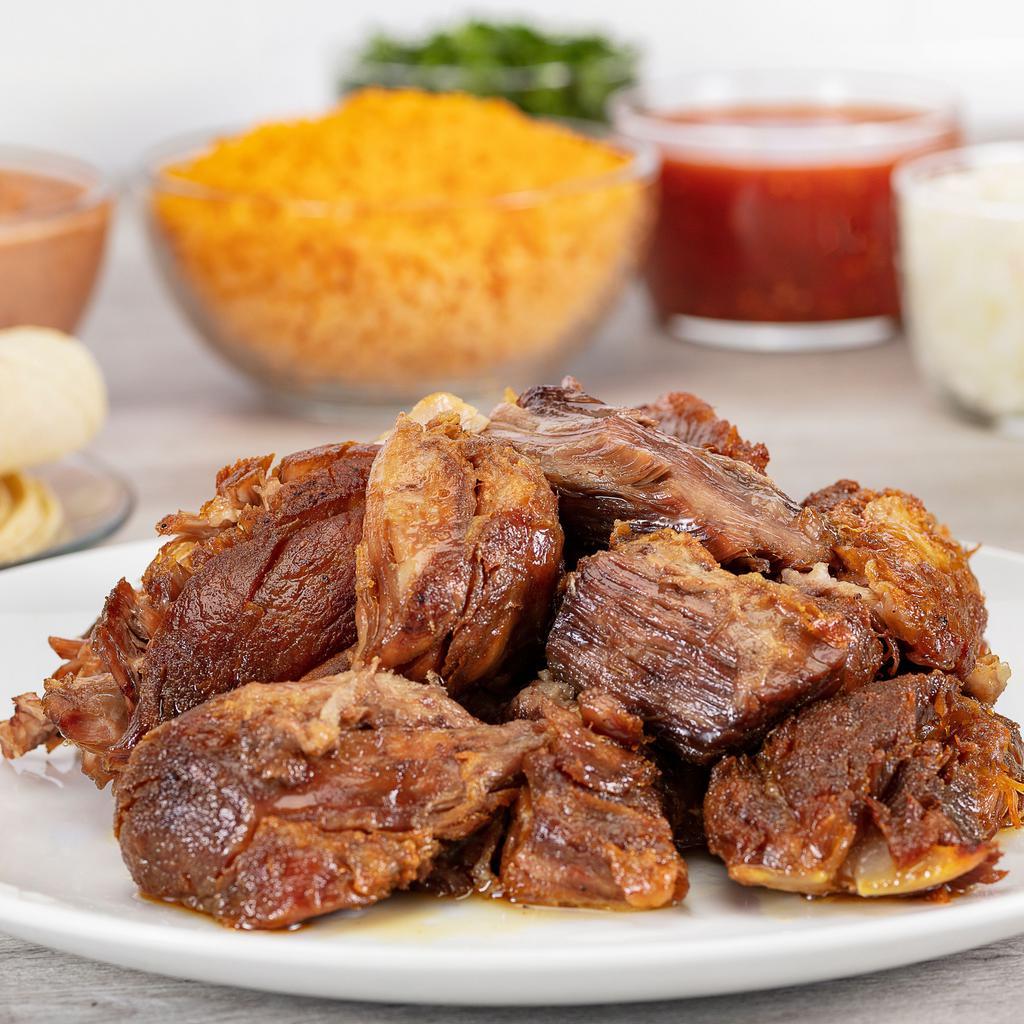 Fiesta Vallarta · 1lb. of Pork Carnitas served with rice, refried or whole beans, green or red salsa, limes, onions, cilantro, and tortillas. Serves two to four people.