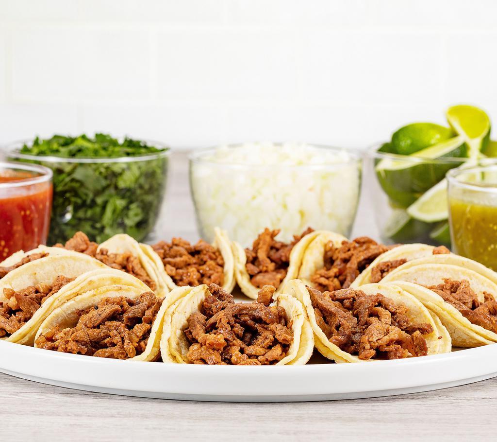 Taquiza Vallarta · 10 street tacos served with choice of meat, green or red salsa, limes, onions, cilantro. Serves two to four people.