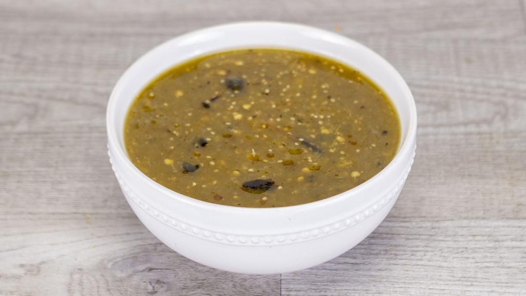 Salsa Molcajete Verde · Traditionally made with a Molcajete,
this salsa is a true staple in every Abuelita’s home.