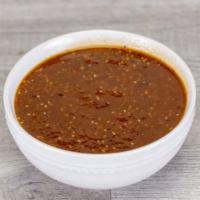 Roasted Tomatillo Chipotle Salsa · Smoky chipotle blended with fire
roasted tomatillo, and savory garlic.