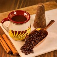 Cafe De Olla · Fresh ground coffee, boiled in a pot with cinnamon and sweetened with piloncillo.