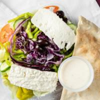 Greek Salad · Tomatoes, cucumbers, onions, olives, and feta cheese in an olive oil dressing.