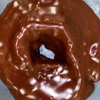 Chocolate Chocolate Cake · Hand rolled and cut chocolate cake donut enrobed in chocolate fudge.