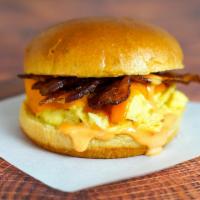Brioche, Bacon, Egg And Cheddar Sandwich · 2 fresh cracked cage-free scrambled eggs, melted Cheddar cheese, smokey bacon, and Sriracha ...