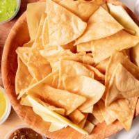 Chips & Salsa (8 Oz) · Authentic house-made crispy tortilla chips served with your choice of one of our signature h...