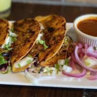 Birria Taco · Stuffed with guajillo & chipotle braised beef, melted jack cheese, onions, cilantro; then gr...