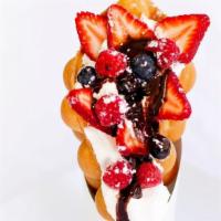 Strawberries Waffle · Strawberries, chocolate & strawberry sauce, whipping cream