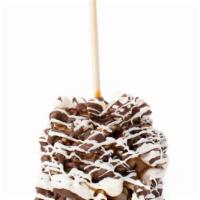Rocky Road Apple · Caramel-covered Granny Smith apple rolled in walnuts and marshmallows, then drizzled with mi...