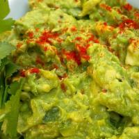 Guacamole · Fresh guacamole served with chips and salsa.