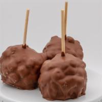 Rocky Road Caramel Apple · Caramel apple rolled in almonds and marshmallows, then dunked in milk chocolate.