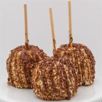 English Toffee Caramel Apple · Caramel apple dipped in white chocolate, rolled in crushed toffee and finished with milk cho...