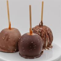Chocolate Sea Salt Caramel Apple · Caramel apple topped with white, dark, and milk chocolate drizzle, then sprinkled with sea s...