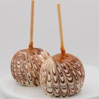 Tiger Butter Caramel Apple · Caramel apple with a tiger butter bath, drizzled in milk chocolate. Tiger butter is a combin...