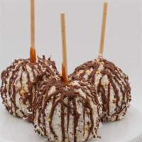 Coconut Almond Caramel Apple · Caramel apple rolled in almonds and coconut, then finished with milk chocolate drizzle.