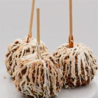 Cinnamon Bear Caramel Apple · Pecan caramel apple, drizzled with white chocolate, then rolled in cinnamon sugar.