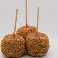 Pecan Pie Caramel Apple · Caramel apple dunked in white chocolate, rolled in a mix of pecans, cinnamon, brown sugar an...