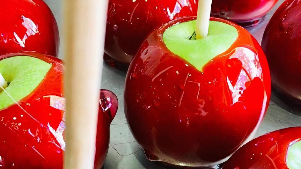 Red Cinnamon Candy Apple · A red cinnamon candy apple.
