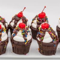 Chocolate Sundae · Dark chocolate cake, iced with buttercream and topped with chocolate, cherry and sprinkles.
