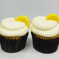 Lemon Drop · Lemon Drop cake is filled with lemon ice.  Iced with buttercream and topped with a lemon can...