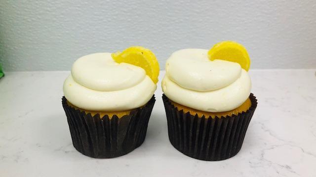 Lemon Drop · Lemon Drop cake is filled with lemon ice.  Iced with buttercream and topped with a lemon candy.
