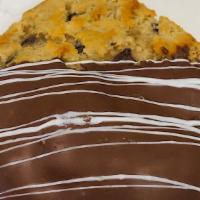 Chocolate Dipped Choco Chip Cookie · Perfectly baked chocolate chip handmade cookie then dunked in creamy milk chocolate with a w...