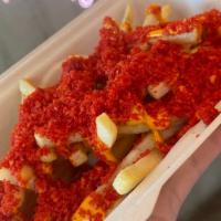 Fire Fries · House sauce drizzled on top of shoestring fries, topped off with Hot Cheetos.