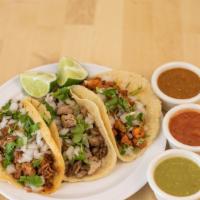 Order 3 Al Pastor Taco · Adobada marinated pork cooked and cut on a spit-grill topped with cilantro and onions. Serve...