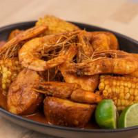 Cajun Shrimp Boil · Cajun-spiced steamed corn, red potatoes, Louisiana Andouille hot links, and shrimp boil.