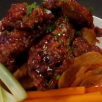 Chicken Wings (8 Pieces) · Juicy chicken wings, Buffalo or spicy BBQ sauce, fries, carrot, and celery sticks, ranch or ...